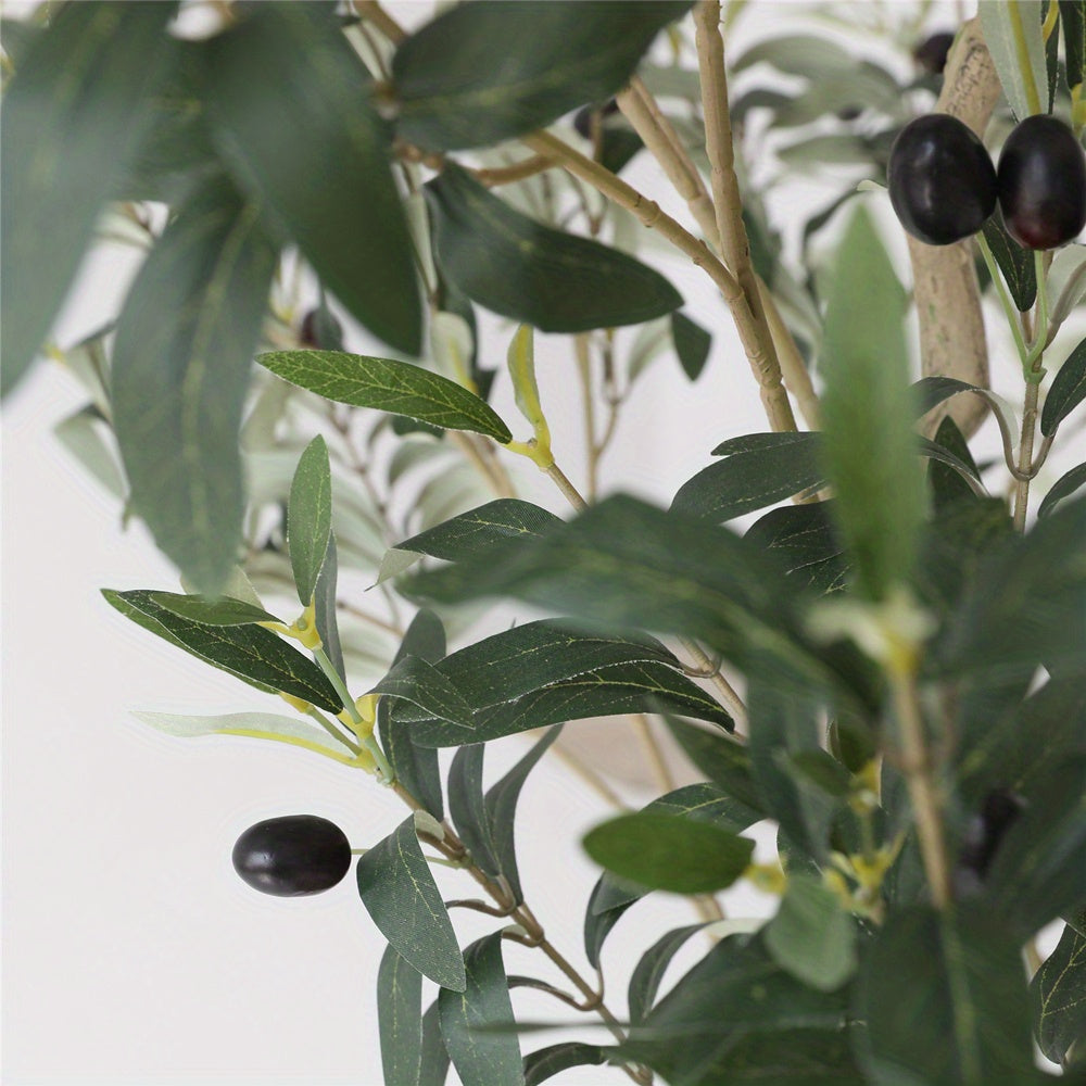 Decorative artificial olive tree placed in modern entryway