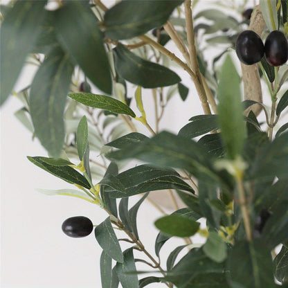 Decorative artificial olive tree placed in modern entryway