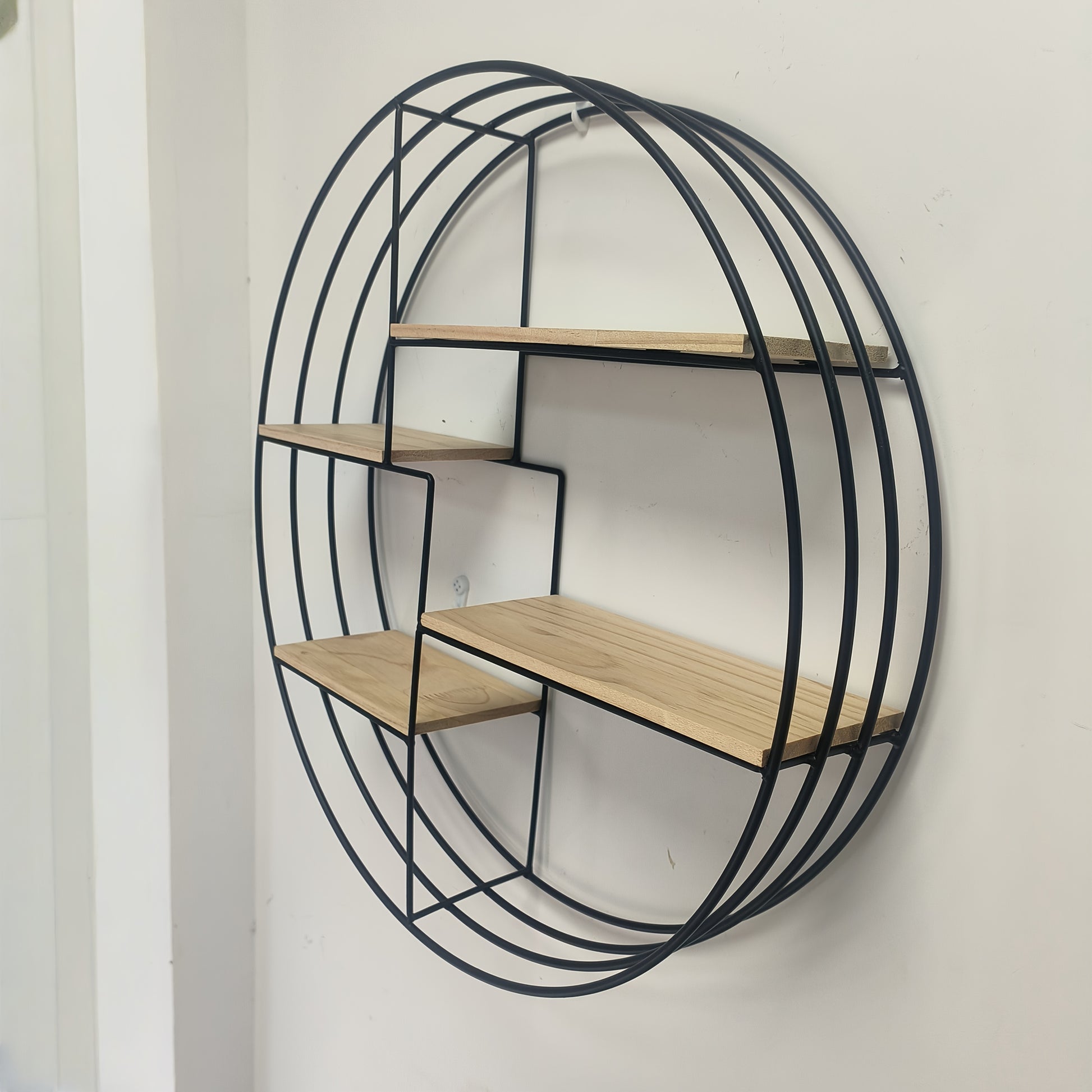 Floating wall shelf with four tiers in a bedroom setting, showing retro design