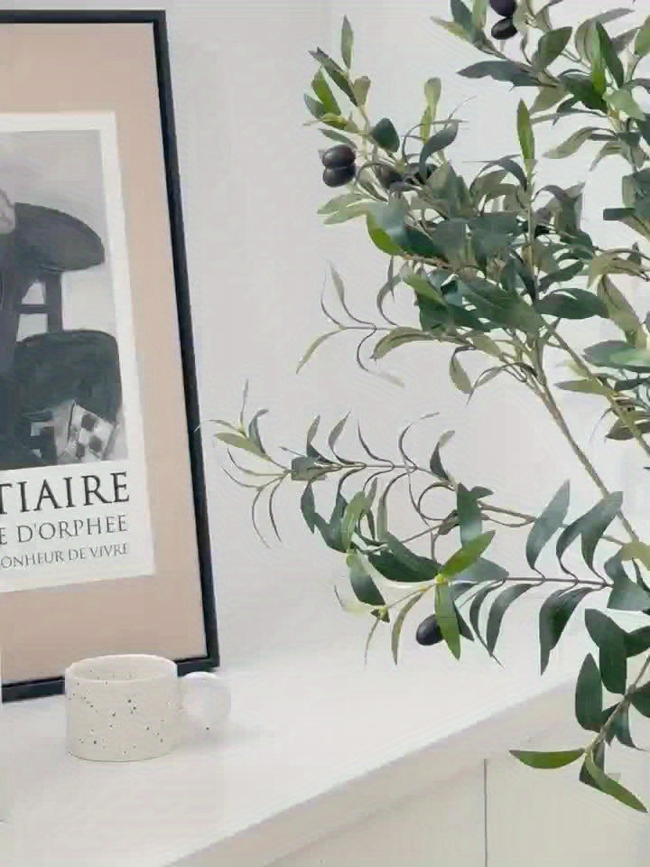 Indoor artificial olive tree styled in neutral aesthetic home