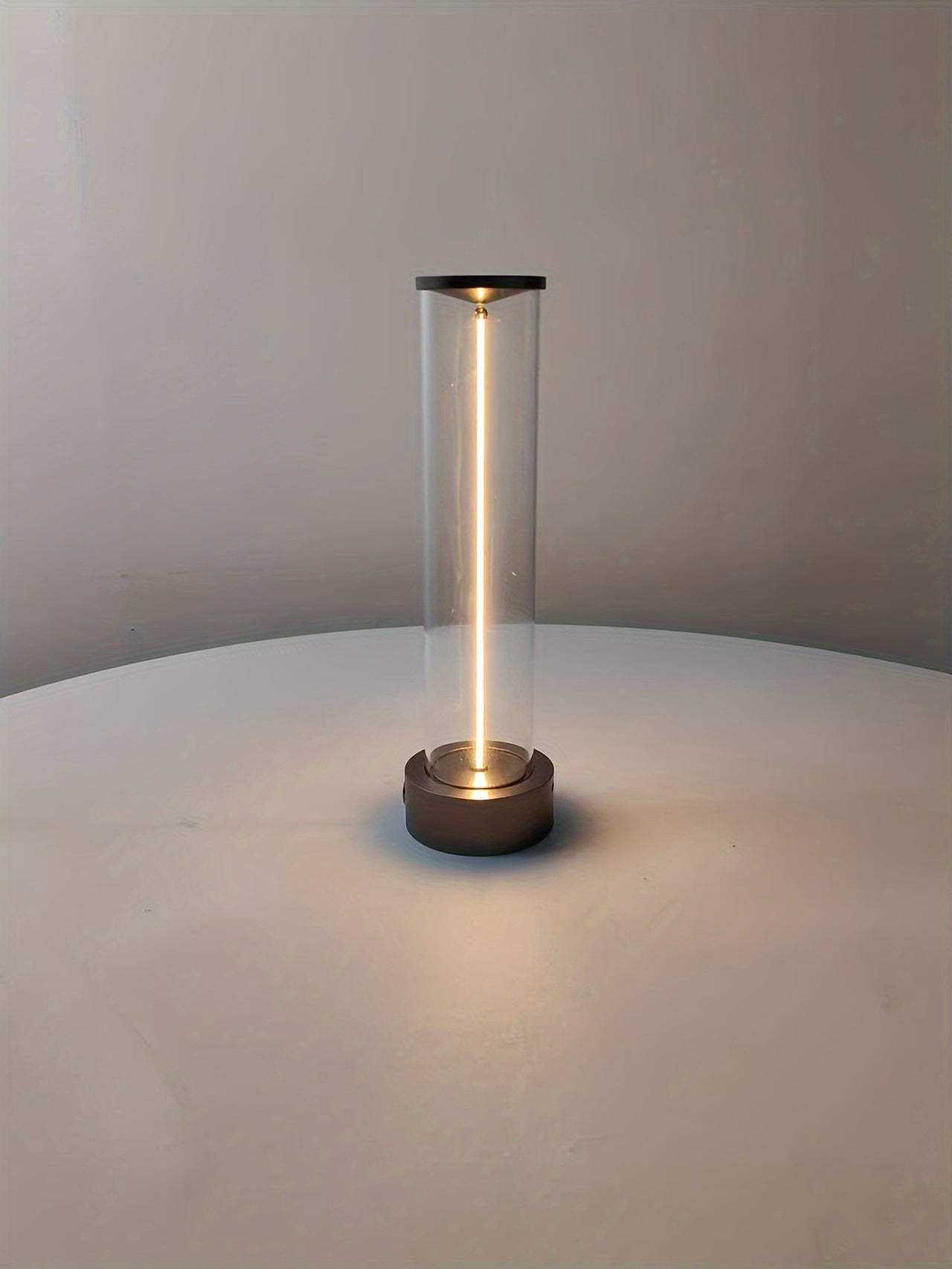 Lifestyle image of minimalist wireless lamp in use