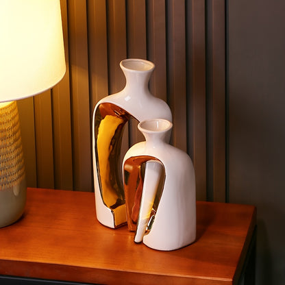 Modern ceramic vases styled on a decorative shelf