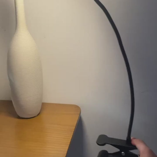 Polished Black LED Desk Lamp Providing Soft Ambient Light