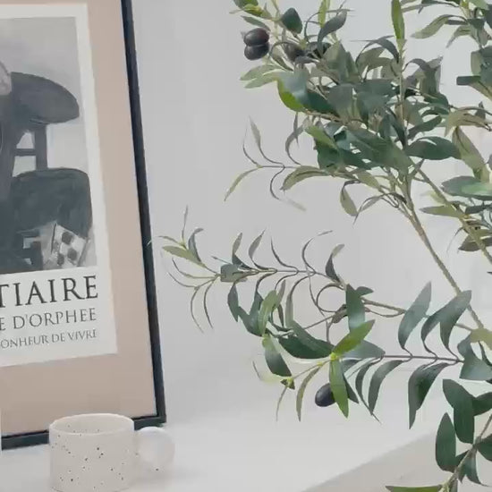Realistic faux olive tree indoor decor with natural green leaves