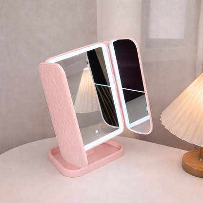 Rechargeable vanity mirror with USB charging cable connected