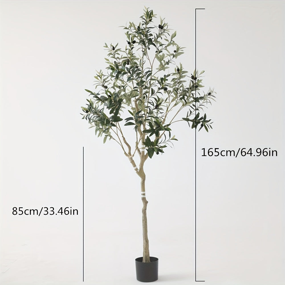 Tall artificial olive tree styled in a neutral modern home