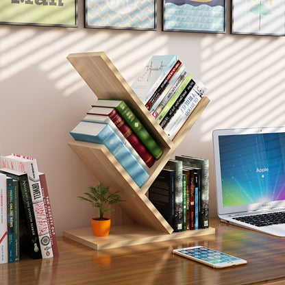 Tree-shaped wooden bookshelf styled in a living room with books and plants