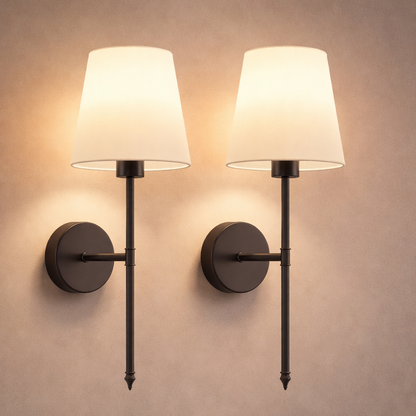 Battery operated wall sconces glowing in bedroom at night for ambient lighting